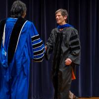 President Mantella shaking awardee's hand